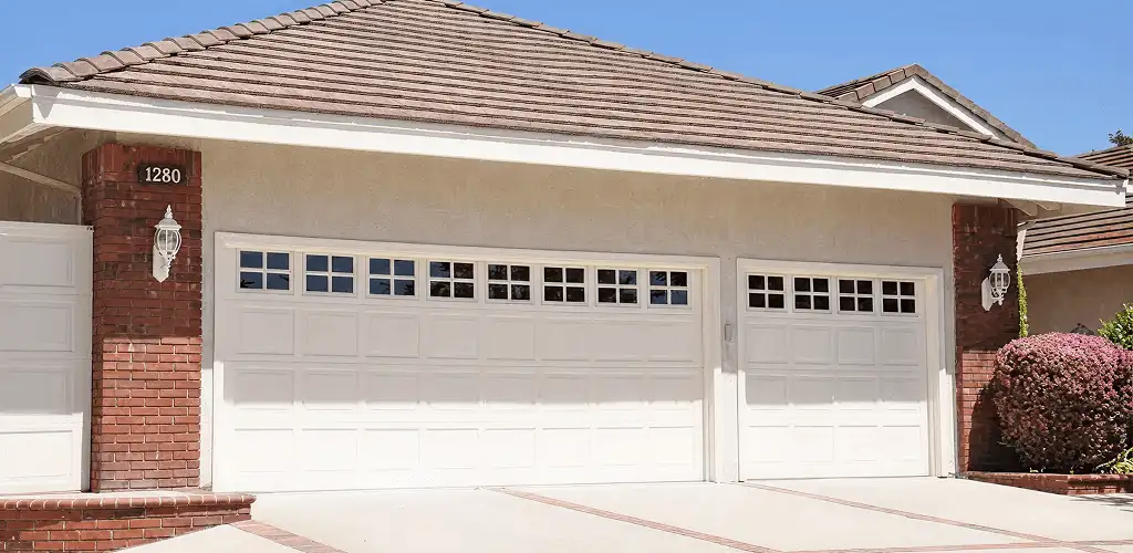 Residential garage door repair service for a double garage door in Duluth, MN