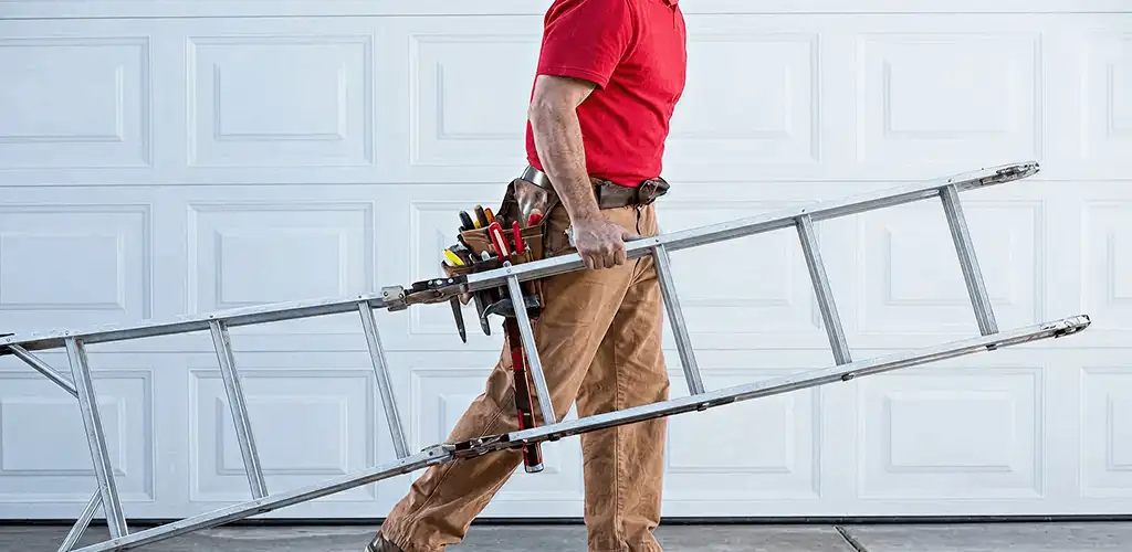 Garage door repair technician arriving with tools and ladder in Duluth, MN