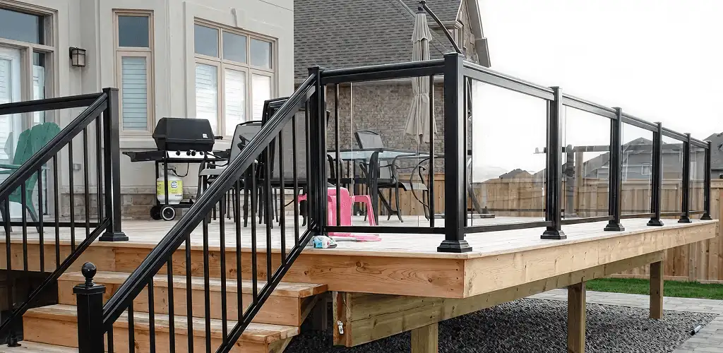 Handrail installation on a deck staircase for safety and code compliance in Duluth, MN