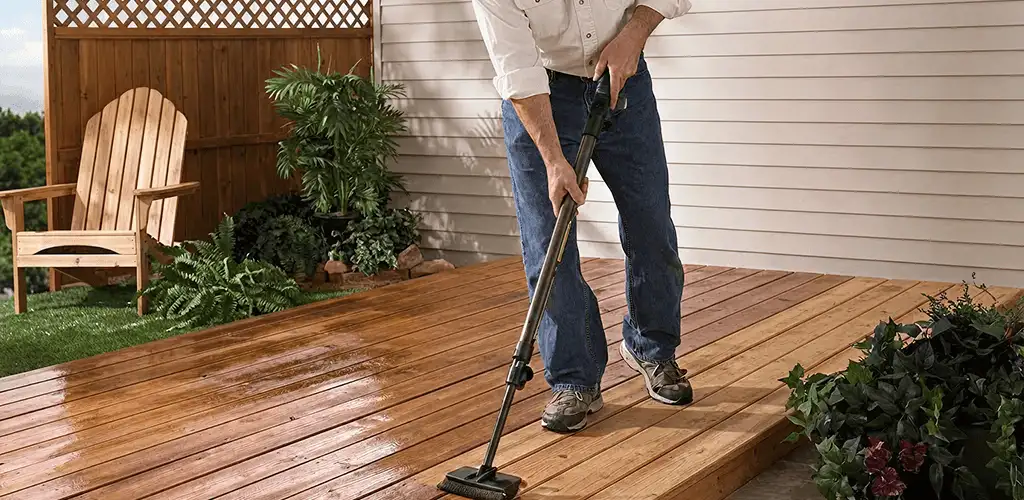 Deck staining service applying stain to a backyard wood deck in Duluth, MN
